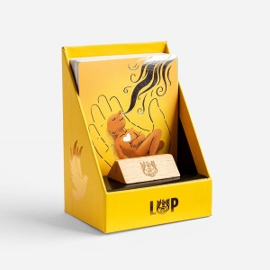 Opened Roots gift box, showing a collection of 45 Illustrated Verse Cards and a little wooden stand, that make great gifts.