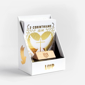 Opened TRINITY gift box, showing a collection of 45 Illustrated Bible Verse Cards and a little wooden stand, that make great christian gifts.  
