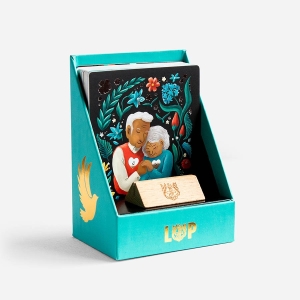 Opened UNITY gift box, showing a collection of 45 Illustrated Verse Cards and a little wooden stand, that make great gifts.