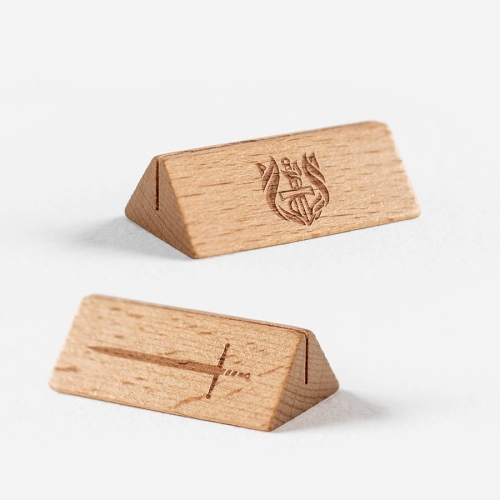 Magentic wooden card stand. Showing both sides of the embossed images